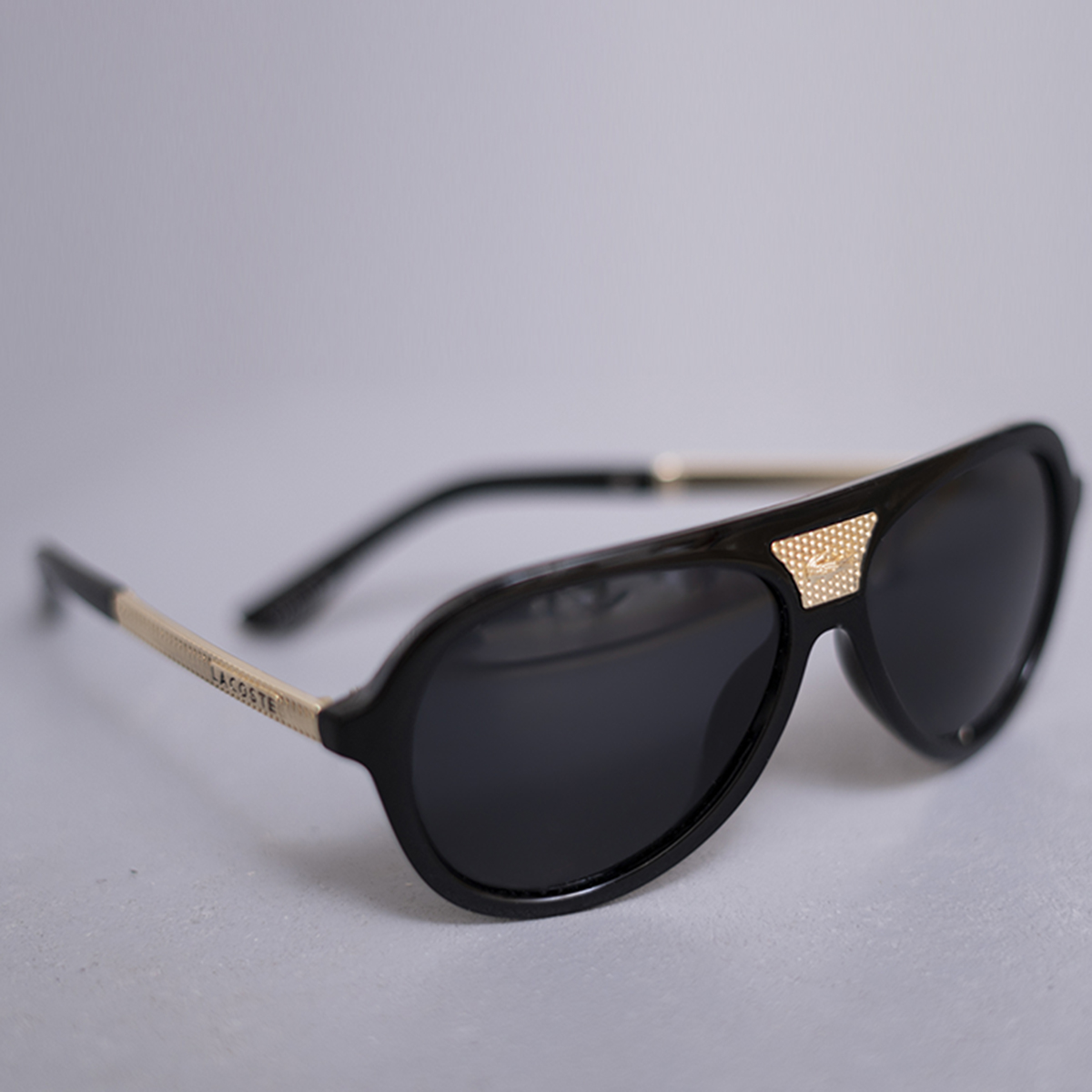 عينك آفتابي LACOSTE مشكي براق